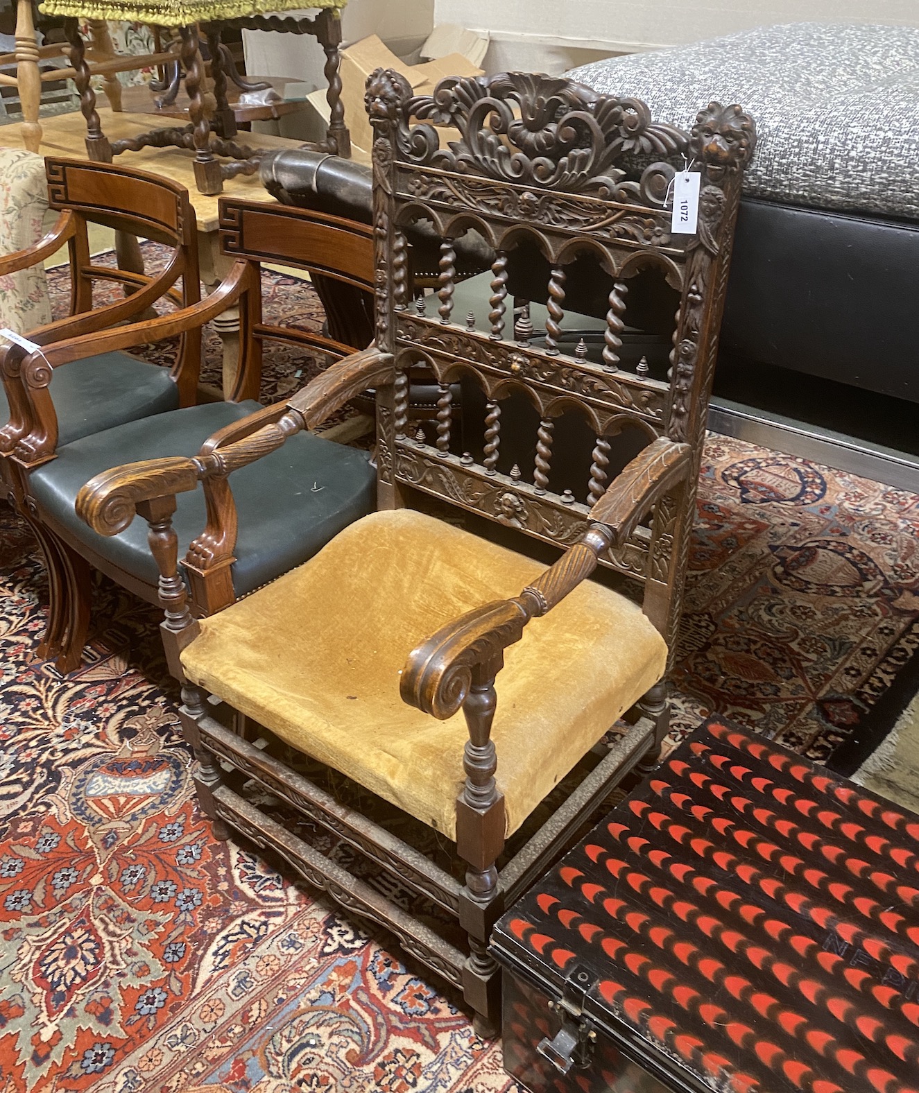 A late 19th / early 20th century Flemish carved walnut elbow chair, width 63cm, depth 56cm, height 114cm